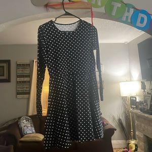 Black with white polkadots , nice dress and very thin.